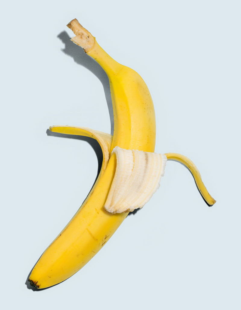 two bananas on blue background